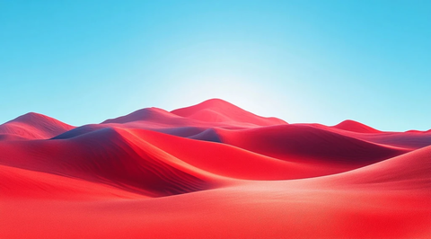 红色沙漠山丘与蓝白天空