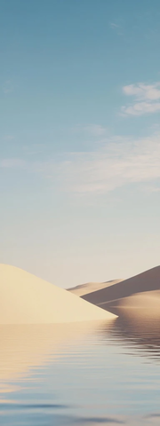 沙漠沙丘平静湖水日落