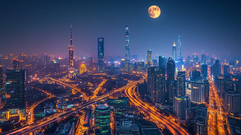 满月下灯火辉煌的城市夜景