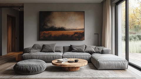 灰色沙发木桌挂画